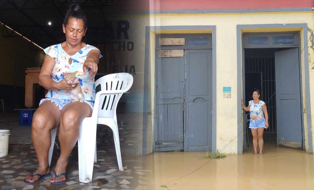 Em bar na Gameleira, dona Rai e seu gato Joãozinho esperam a vazante do rio